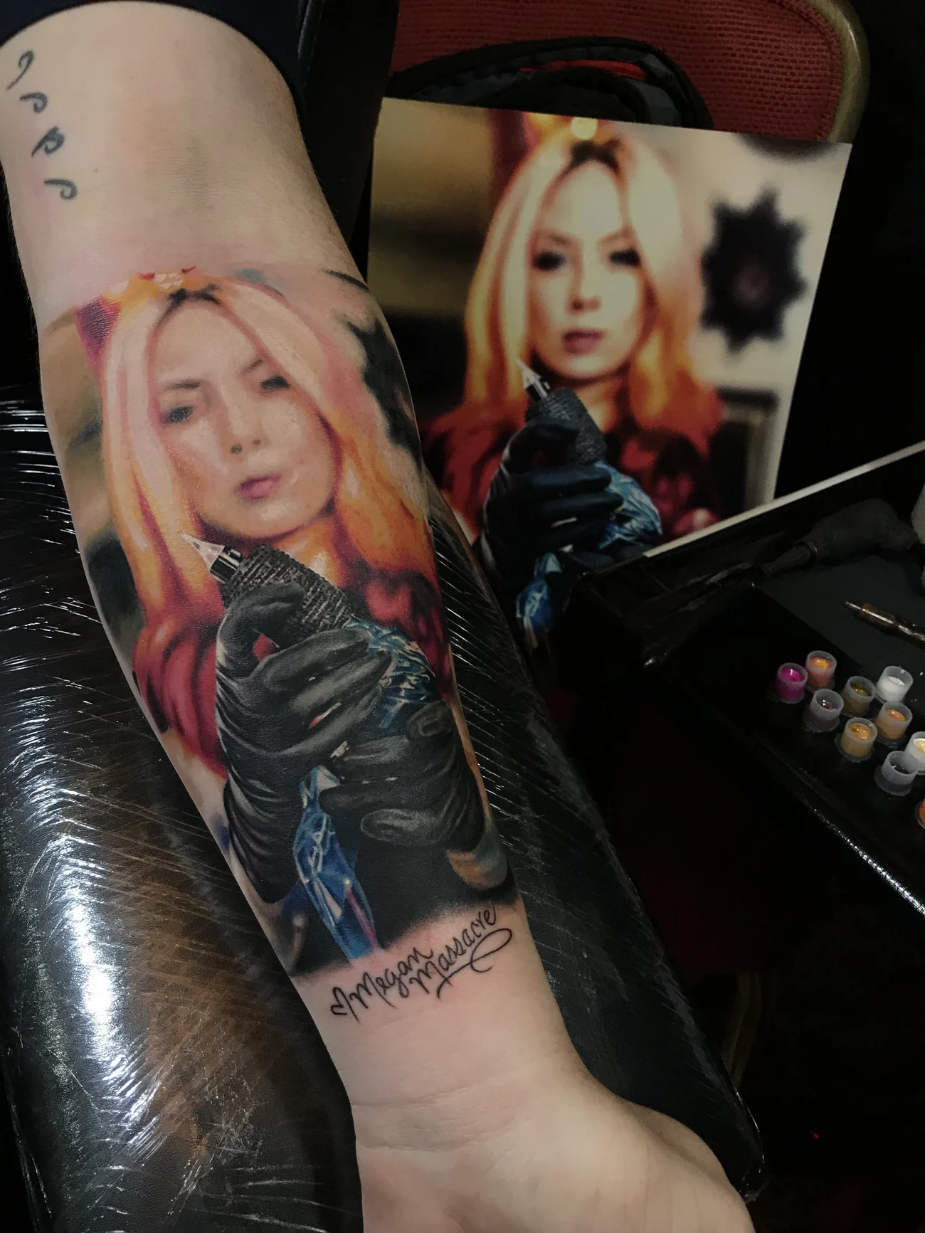 Portrait of Megan Massacre in colour realism on the forearm, signed by her, by H